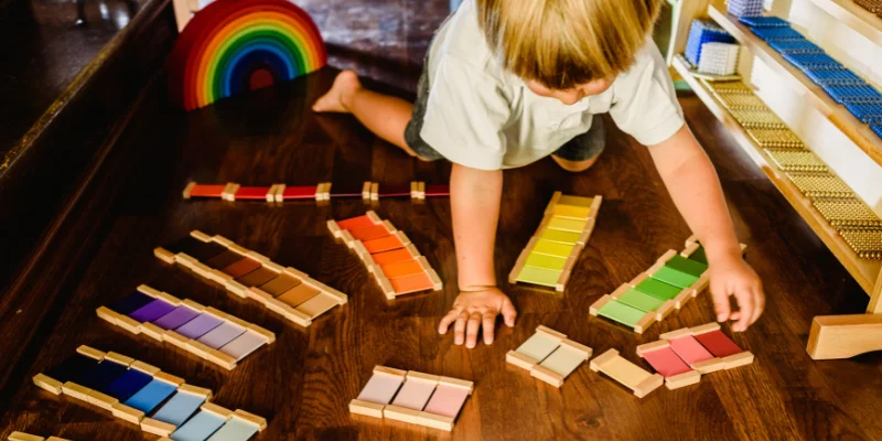 Montessori Childcare in QLD - Young child discovering colour schemes